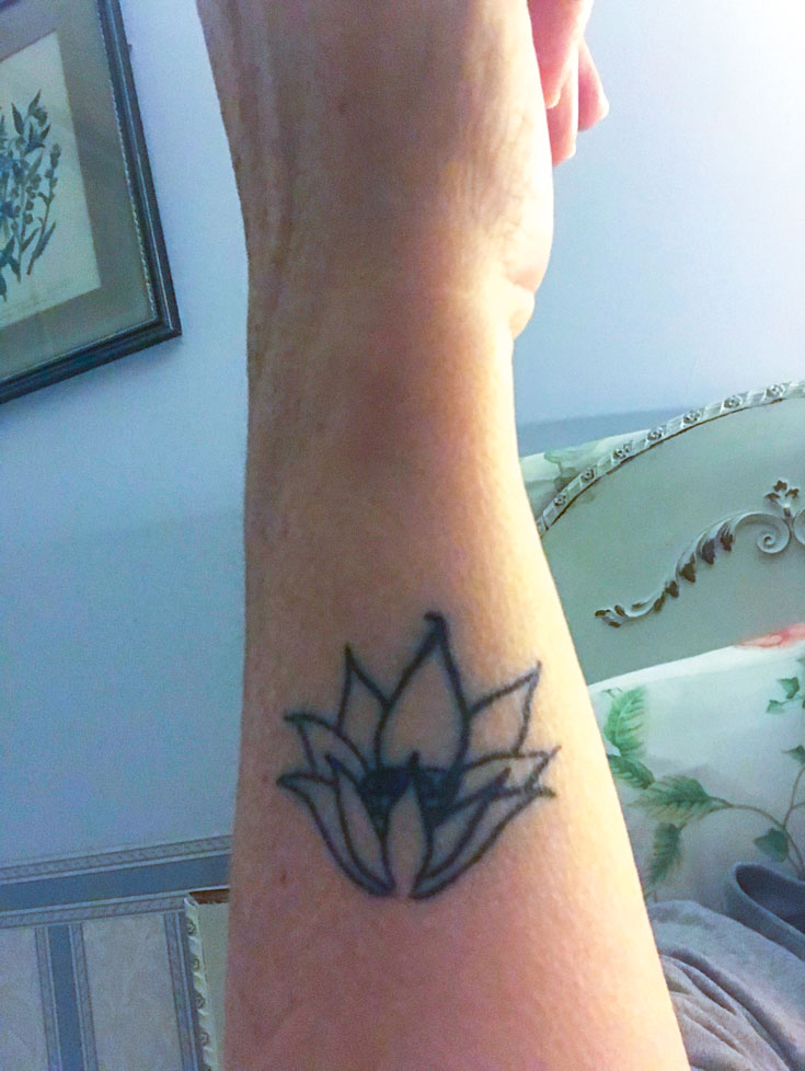 A tattoo of a flower.