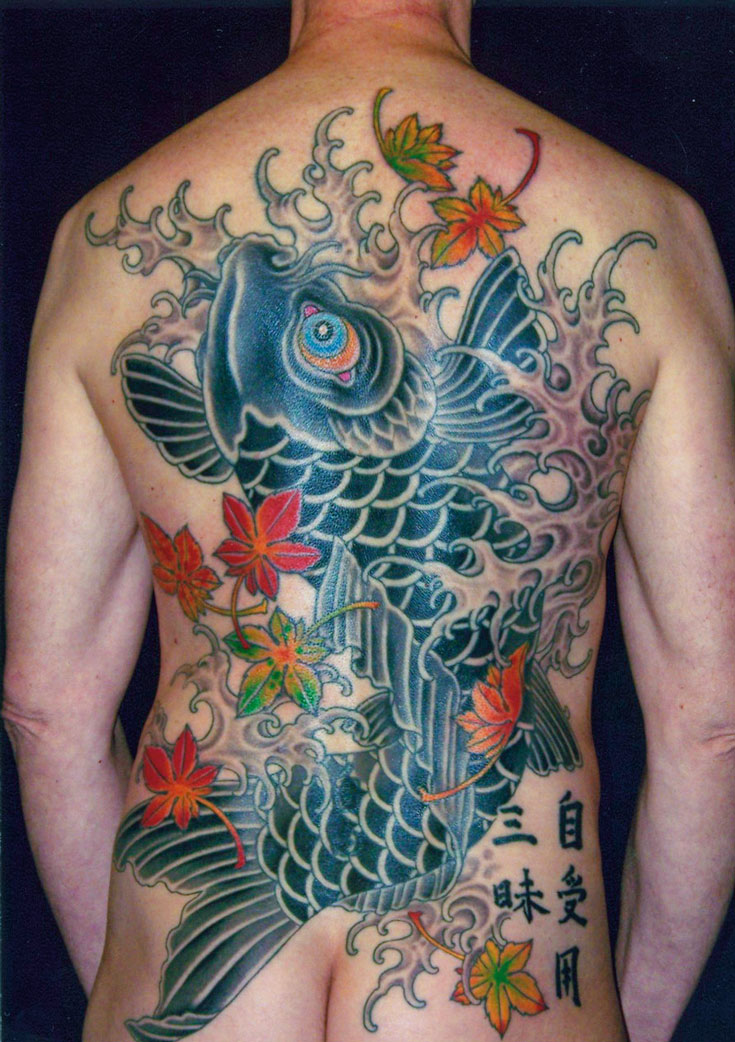 A tattoo of a fish with flowers on the outside.
