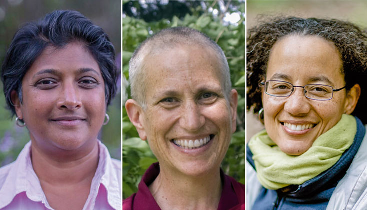 A photo of three women, all smiling at the camera.