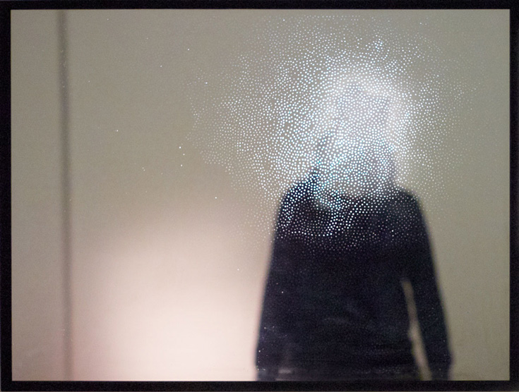Long sleeve black shirt with the face bloced out by white dots.