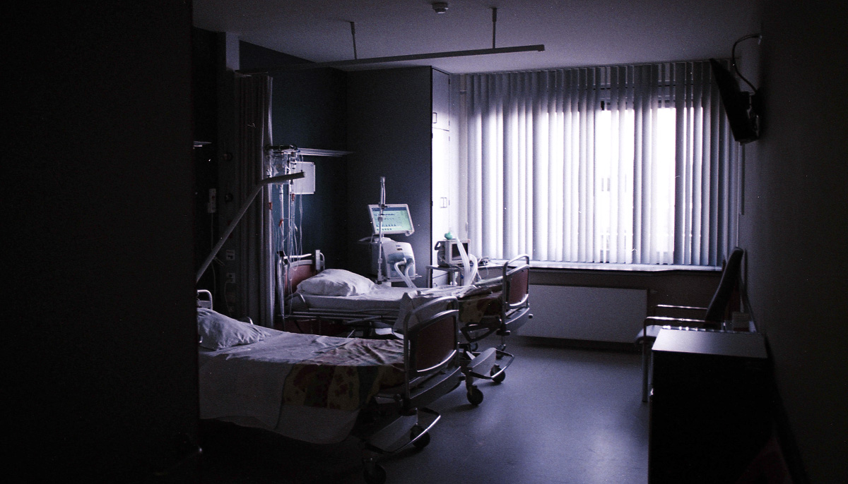 Three hospital beds in a hospital room