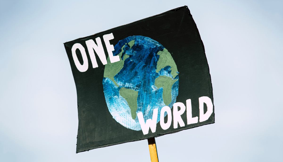 image of poster with "One World" and Earth painted