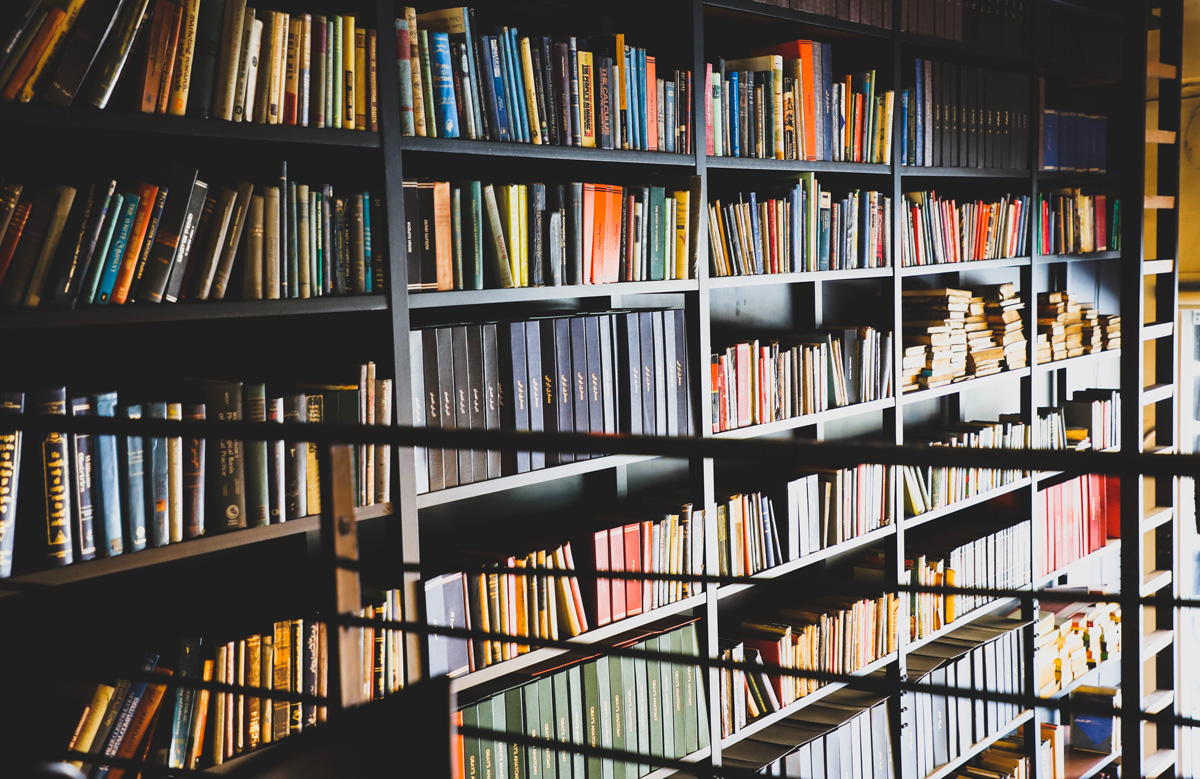 A photo of a large bookshelf covered in books.