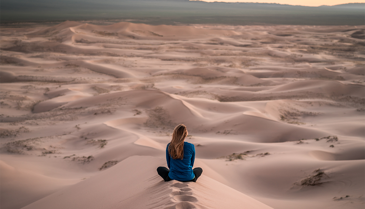 Woman meditating in the desert