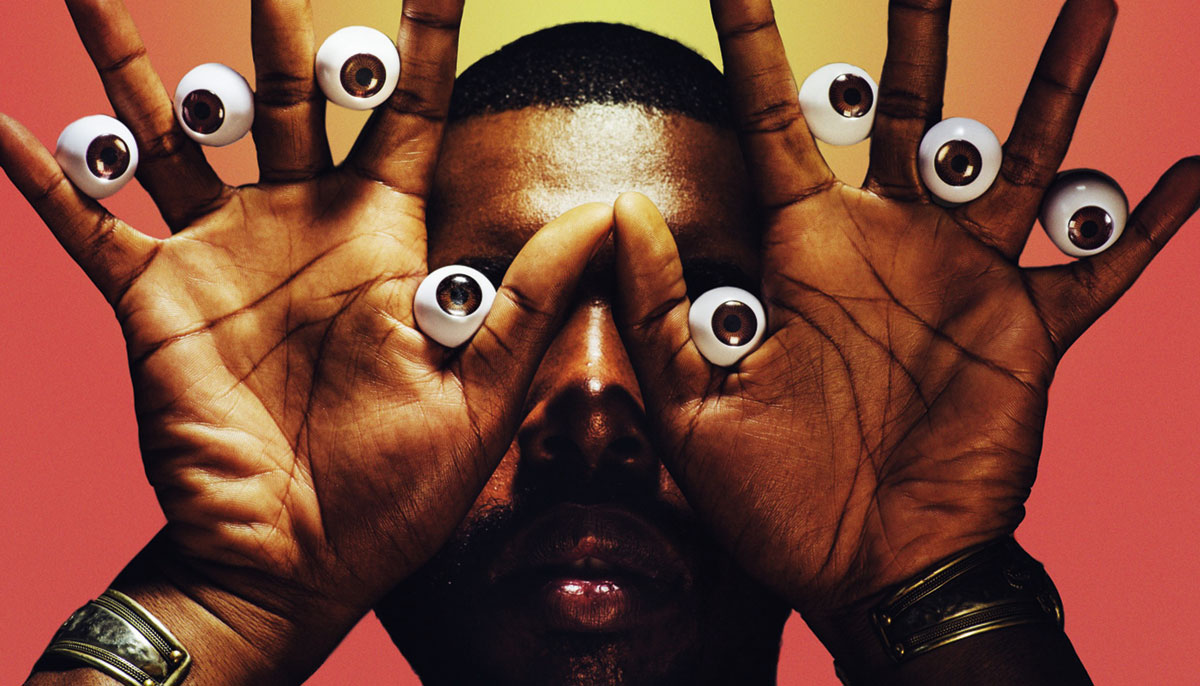 A man holding eyeballs between his fingers.