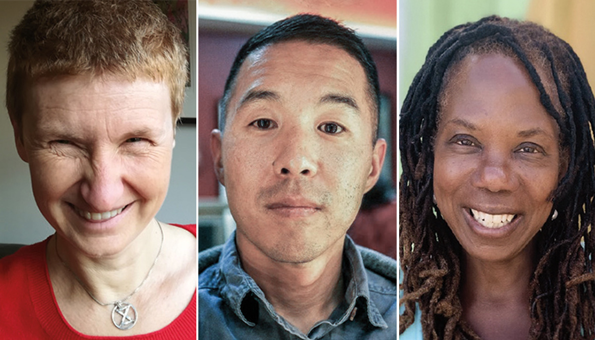 A photo of three people, all smiling at the camera.