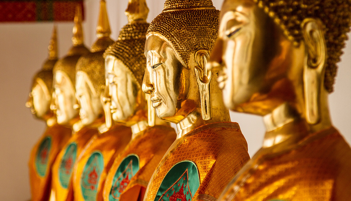 Golden statues all in a line.