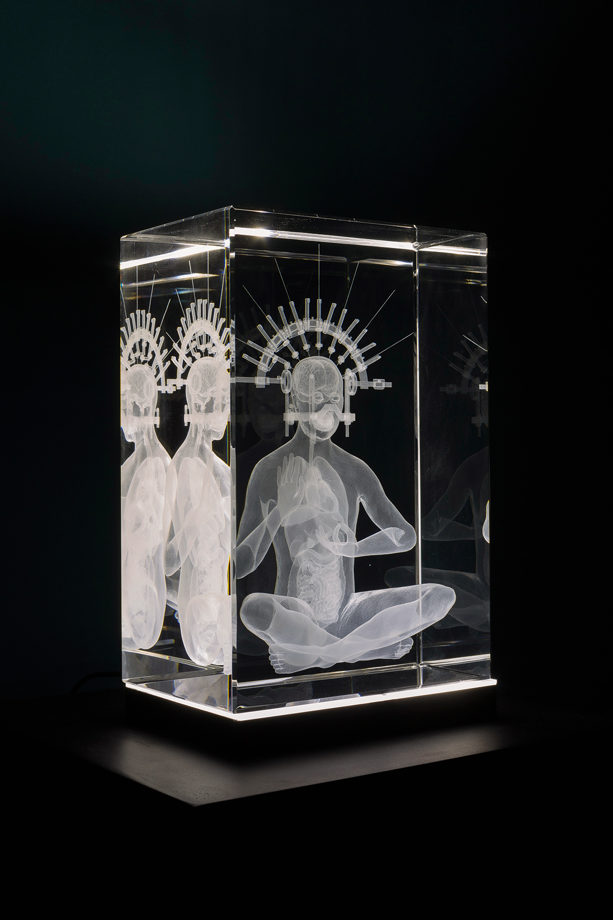 A person in a glass cube.
