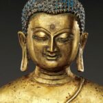 Sculpture of Shakyamuni Buddha sitting and touching the earth.