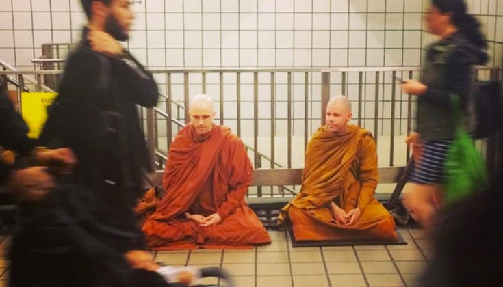 Monks meditating in the New York subway.