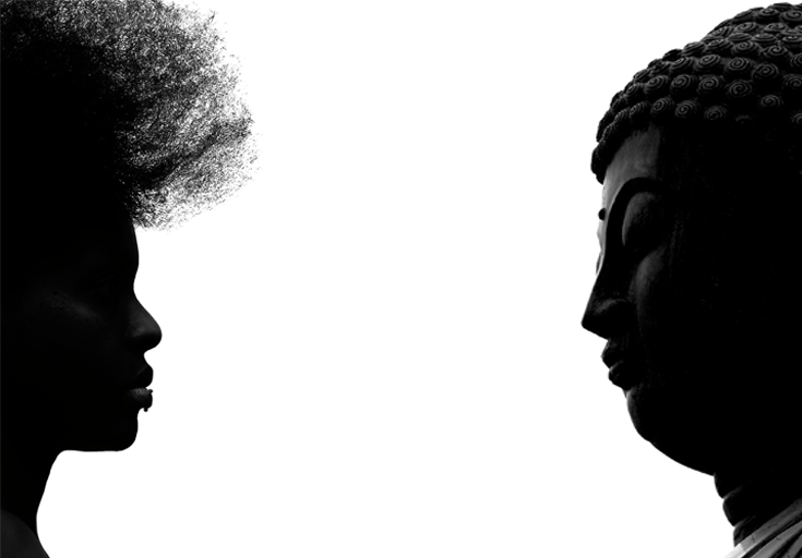 Buddha facing African-American woman.