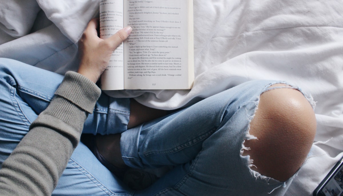 Reading book while meditating.