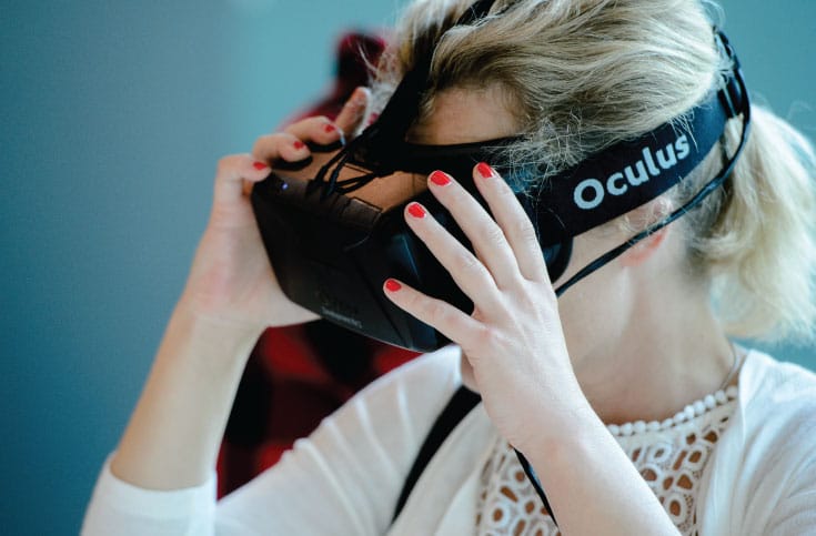 A woman wears Oculus Rift.