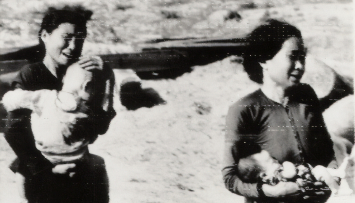 Vietnamese mothers crying while holding babies