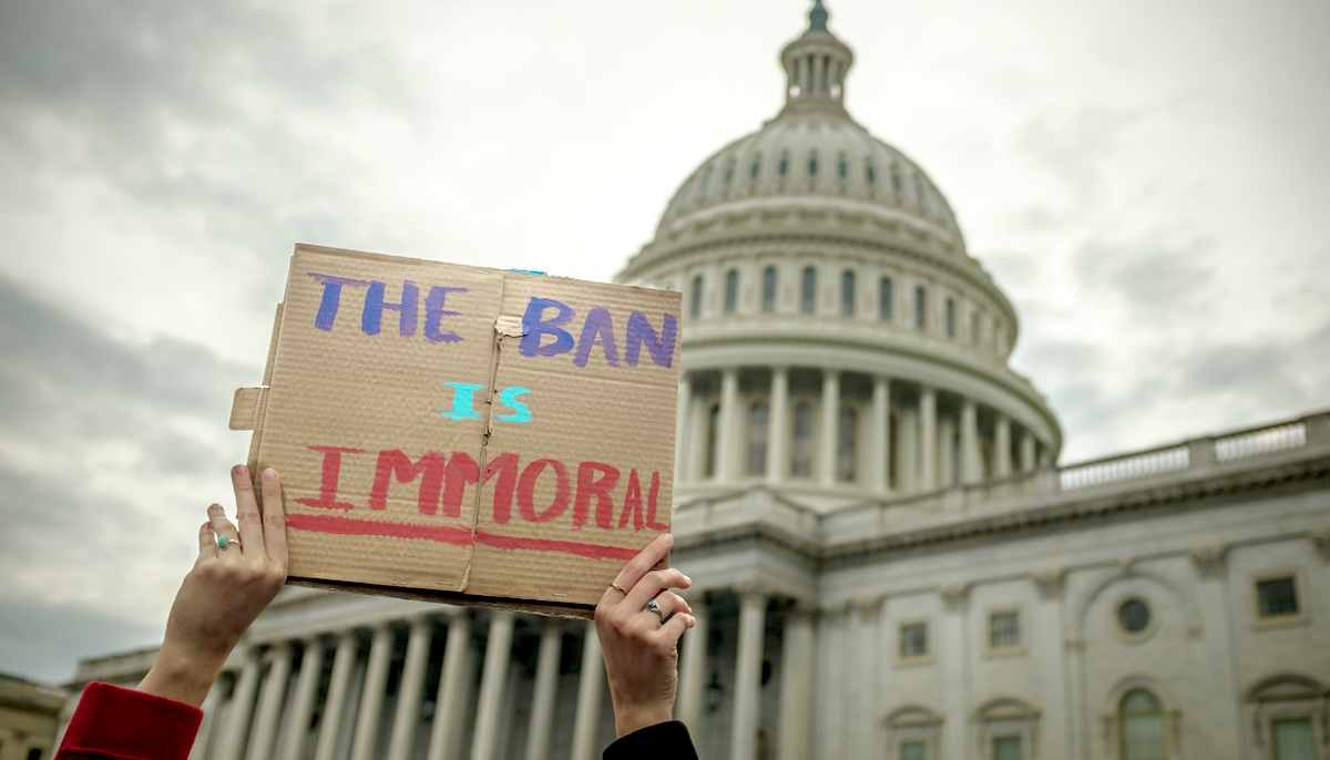 Sign that reads  the ban is immoral  in front of Capitol Hill.