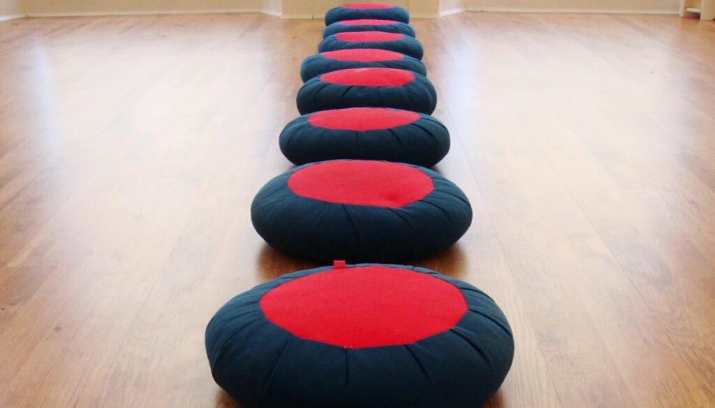 A row of meditation cushions.