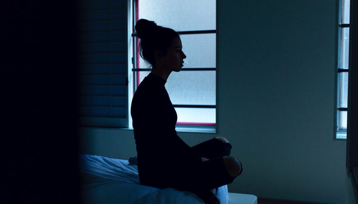 Sad woman sitting in meditation