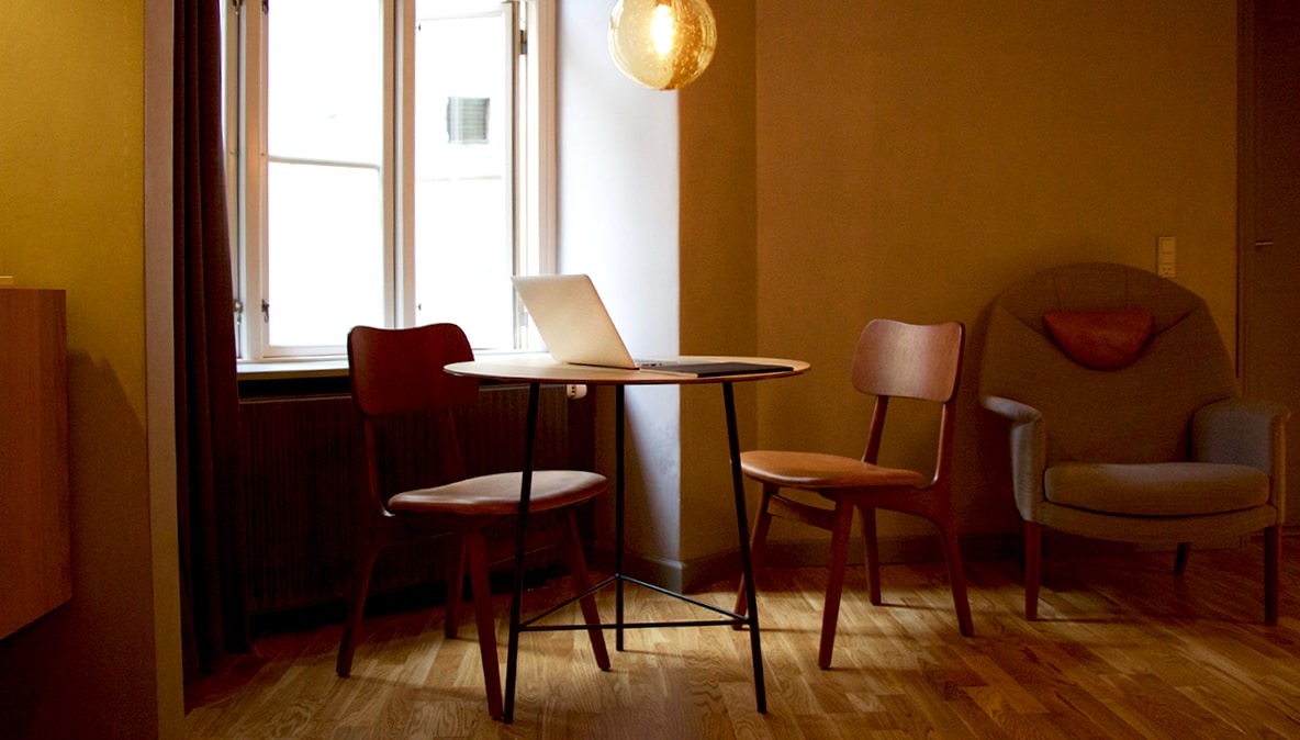 Chairs and a table in a tidy room.