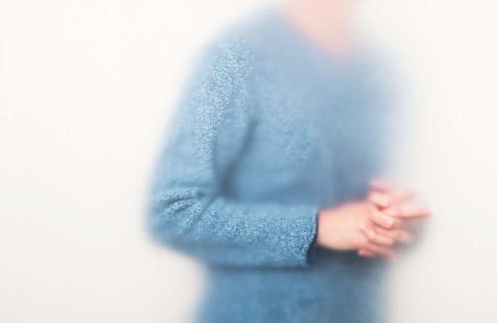 Photo by Ann Hamilton of man in blue sweater.