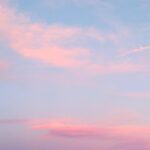 Pink clouds in blue sky