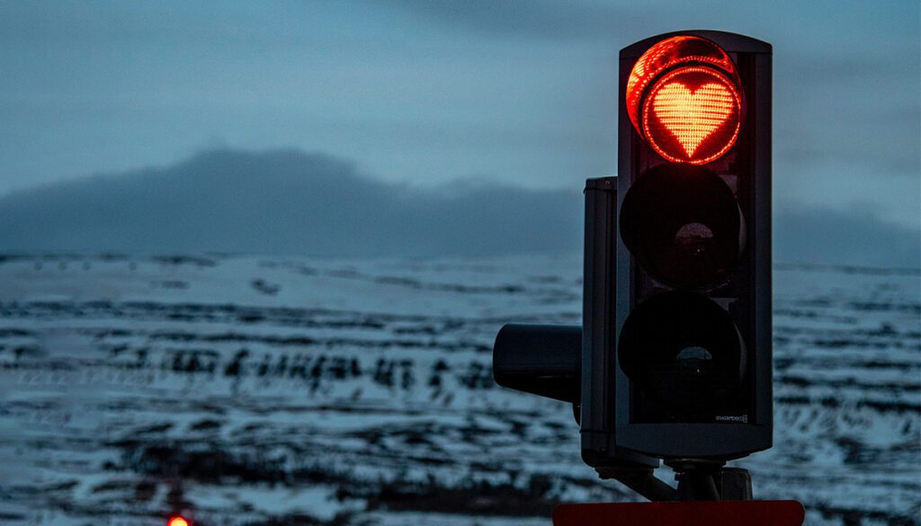 Traffic light with red light in the shape of a heart