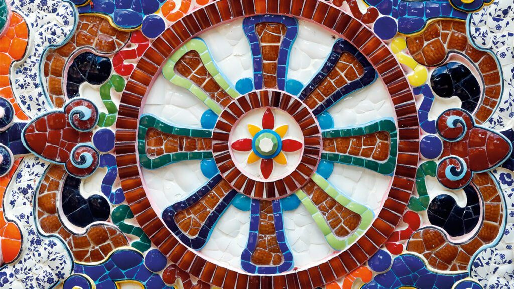 What is the Dharma Wheel (Dharmachakra) in Buddhism?