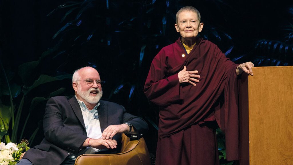 Pema Chodron stands next to a seated Gregory Boyle