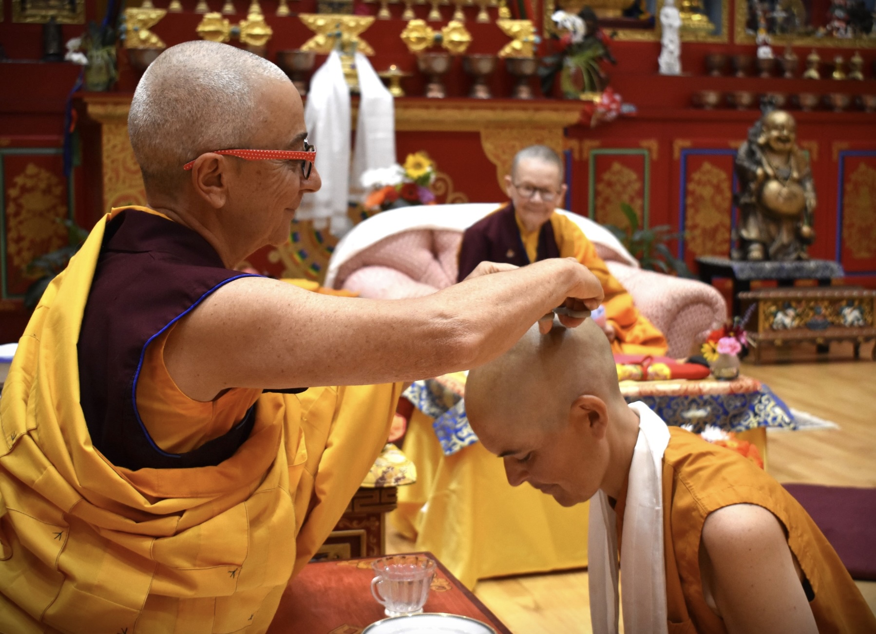 Amanda Atwood of Harare, Zimbabwe is seen in a Buddhist hair-cutting ceremony, part of her ordination.