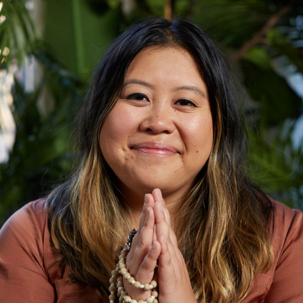 Portrait of Kim Thai, a writer, mindfulness teacher, community organizer, and Emmy-award-winning storyteller.