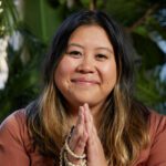 Portrait of Kim Thai, a writer, mindfulness teacher, community organizer, and Emmy-award-winning storyteller.