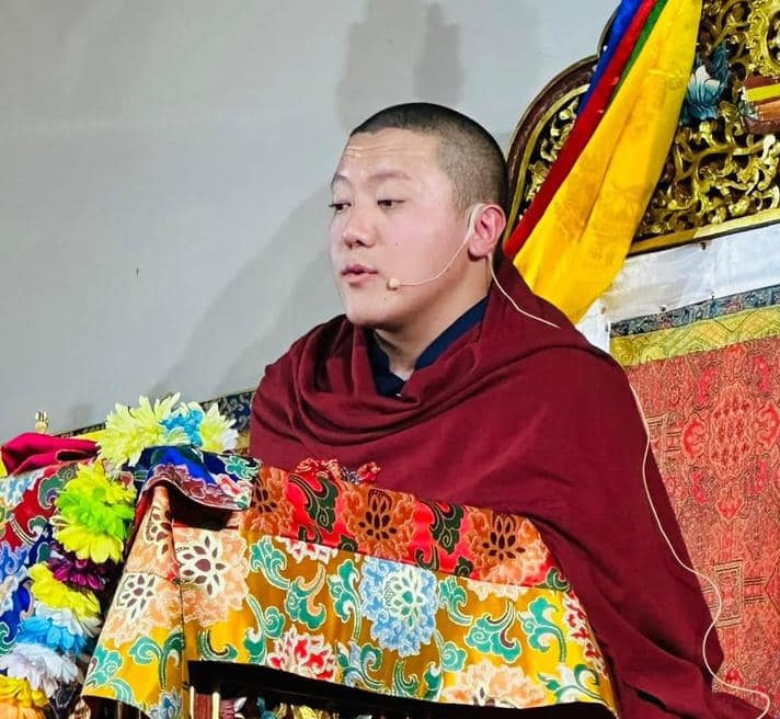 Dilgo Khyentse Yangsi Rinpoche is seen at his teaching throne.